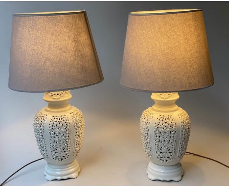 TABLE LAMPS, a pair, reticulated white ceramic of vase form with shades, 76cm H. (2) 