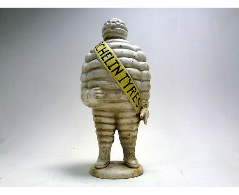 Features 'Monsieur Bibendum' in a standing position, constructed of cast iron, he wears a sash reading 'Michelin Tyres', unli