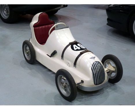 A completely restored example of this scarce and highly collectable child's pedal car, being based on the supercharged twin-c