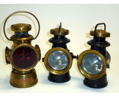 To include a Lucas 434 'King of the Road' brass rear lamp, together with a pair of H&B brass sidelamps. Varied condition. (3)