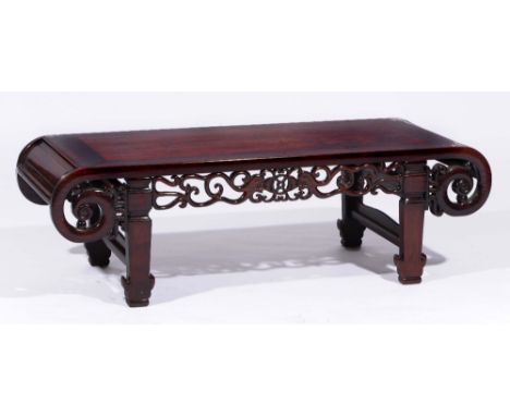 A Chinese hardwood low table 19th Century with scroll frieze, 107cm across