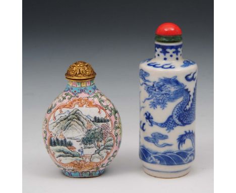 A Chinese blue and white snuff bottle 1800-1850 of rouleau cylindrical form, decorated with two five claw dragons above waves