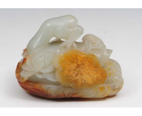 A Chinese white and russet jade carving Qianlong (1736-1795) in the form of a goose with it's head turned over it's shoulder,