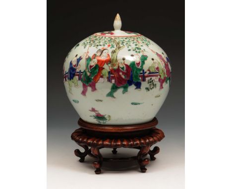 A Chinese ovoid jar and cover 19th Century decorated in enamels with boys playing in a garden, with hardwood stand,  21cm hig