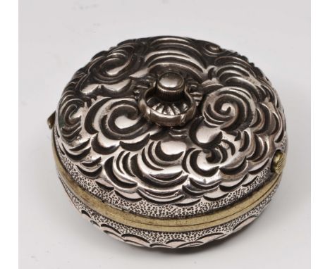 A Japanese silver and sentoku manju netsuke compass mid 19th Century the case finely worked with dragon amidst scrolling clou