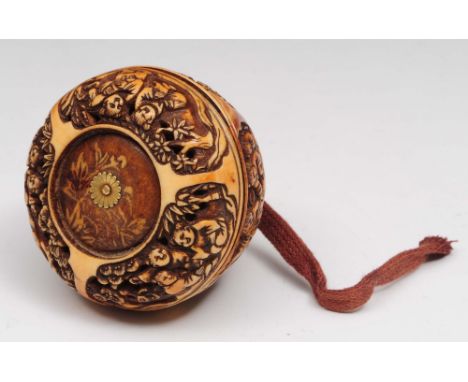 A Japanese ivory Manju netsuke Meiji period carved with panels of karako, the top inset with gilt flower head, 3cm high