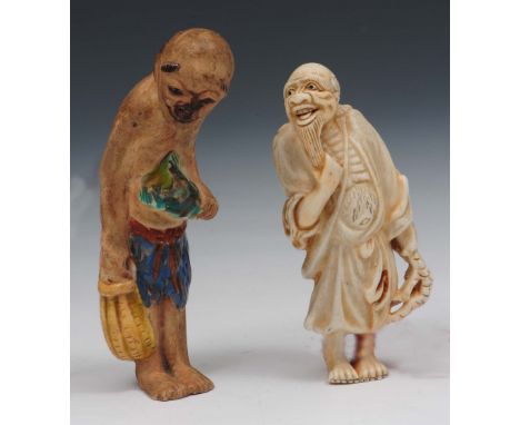 Two Japanese Hirado porcelain netsuke 19th Century by Masakazu, the first modelled as a fisherman holding a toad, the second 