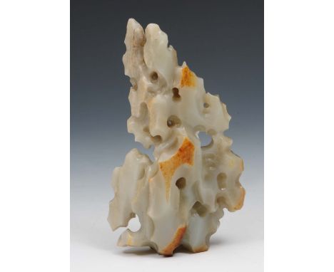 A Chinese white and russet jade boulder 18th Century in the form of a Taihu rock, 16.5cm high