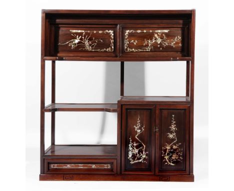 A Chinese rosewood and mother of pearl cabinet late 19th Century having sliding doors inlaid with fan, bamboo and phoenix, of