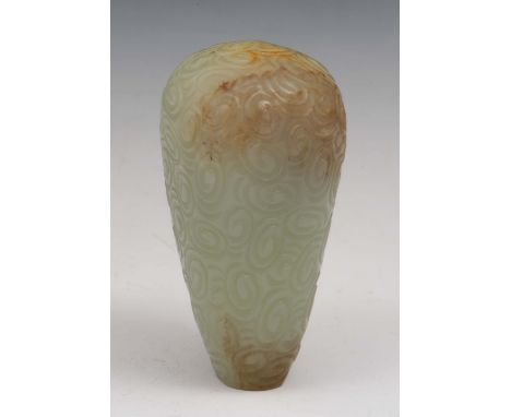 A Chinese jade pendant 18th/19th Century of tapered form with allover carved scrolls, 6.5cm