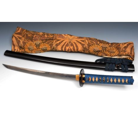 A Japanese sword 19th Century with shakudo and shagreen handle, signed Sukesada from Bizen (Okayama) in an ebonised scabbard 