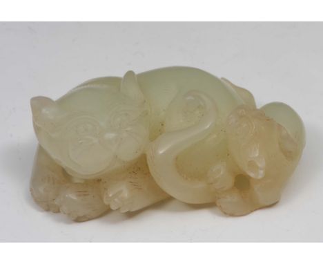 A Chinese jade group 18th Century in the form of a recumbent lion and cub, 6.5cm long
