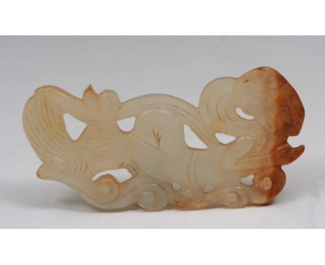 A Chinese white and russet jade carving 19th Century in the form of an Apsara lying down, with long hair and flowing robes, 6