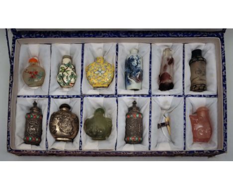 A collection of eleven Chinese snuff bottles 20th Century including glass, silver and others