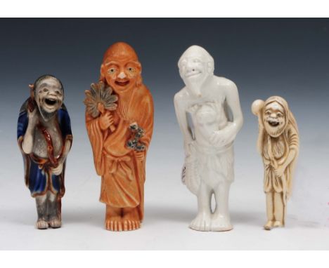 Four Japanese porcelain netsuke 19th century one modelled as a standing Sennei holding a staff, another of blue glaze holding