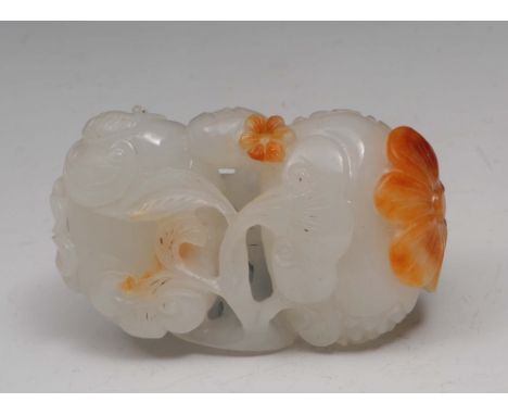 A Chinese white jade carving of fruit 19th Century with russet flower heads and ling chi