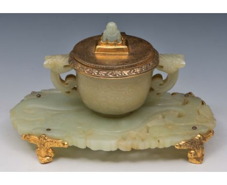 A Chinese jade ink stand 18th Century in the form of an engraved two handled cup mounted on a large jade pendant engraved to 
