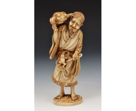 A Japanese ivory okimono of Sennin Gama Meiji period signed Ryokoku, the figure standing holding a fan upon which a toad clim