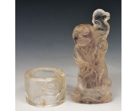 A Chinese rock crystal archer's ring 19th Century carved with seated Immortal in mountainous landscape and a rock crystal snu