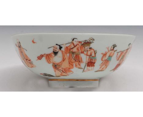 A Chinese porcelain bowl Qing dynasty with Daoist figures, with a band of travellers with a donkey, bats, a stork, and some p