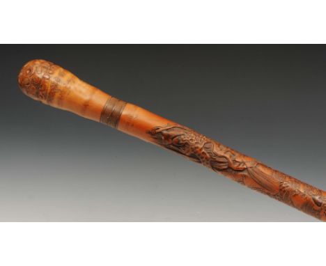 A Japanese bamboo walking stick late 19th Century carved with three monkeys