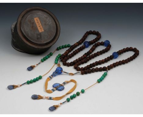 A Chinese Chen Xing necklace 19th/20th Century with wood and jade beads and with inset Peking blue glass carved roundels and 