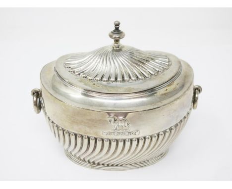 A Victorian silver oval gadroon fluted Tea Caddy with regimental crest and ring handles, London 1896 