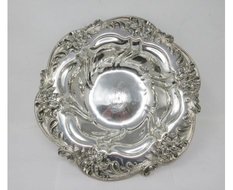 A sterling silver circular Bowl with lily border, engraved initials, 11 3/4 in diameter, 460 gms. 