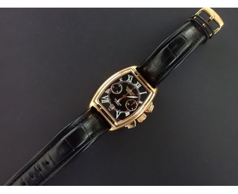 A Poljot Russian Chronograph, the tonneau shaped black dial with stylised Roman numerals, subsidiary dials at 3 and 9, date a