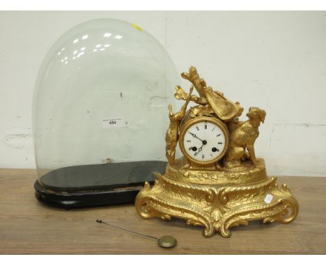 A French gilt metal Mantel Clock the circular dial flanked by dog and game with pierced scrolled base under glass dome 1ft 4i