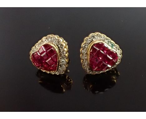 A pair of Ruby and Diamond Cluster Earrings invisibly-set group of calibre-cut rubies within heart shaped frame of brilliant-