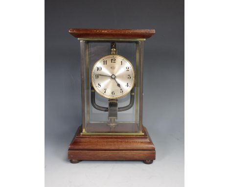 A Bulle Mantel Clock in glazed and mahogany Case on bun feet 10 1/2in H x 7in W 