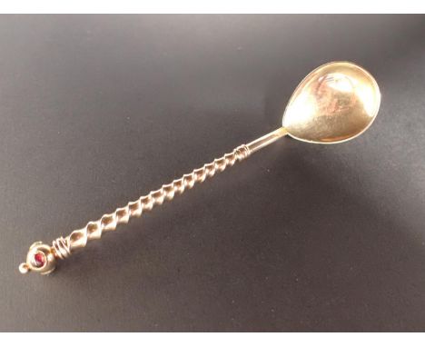 A gold Spoon with pear shape bowl, spiral stem with knop finial set turquoise, ruby and emerald type stones, 11cms, 13.2gms, 