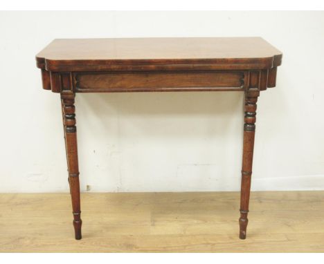 A 19th Century mahogany fold-over Card Table with shaped rectangular top, moulding to the frieze and raised on turned support