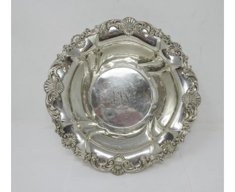 A sterling silver circular Bowl with scallop and scroll border, engraved initials, 10in diameter, 372 gms. 