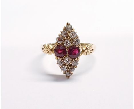 An Edwardian Ruby and Diamond Ring, the marquise shaped plaque pavé-set two round rubies between twelve old-cut diamonds in 1