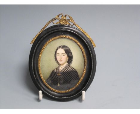 CONTINENTAL SCHOOL, c.1830. Portrait miniature of a Lady, quarter-length, wearing a black dress, oval, 2 3/4 x 2 1/4in 