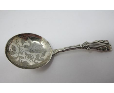 A Victorian silver Caddy Spoon with leafage engraved circular bowl, Birmingham 1838, maker: G. Unite, stem repaired, and a pl