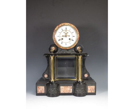 A black slate Empire style Mantel Clock by Duplan &amp; Salles with embossed panels depicting Putti and white enamel dial wit