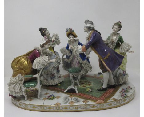 A Dresden Centrepiece of five figures playing blind man's bluff, with oval base, 17in W 