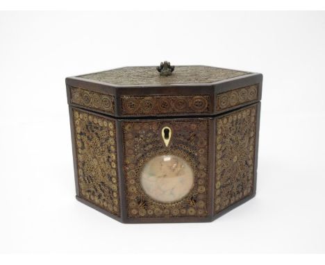 A Georgian mahogany and rolled paper Tea Caddy of hexagonal form with circular convex glass covered panel of a girl 7in W x 4