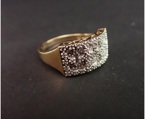 A 9ct gold Dress Ring the front with pierced motif set numerous synthetic stones, ring size S 