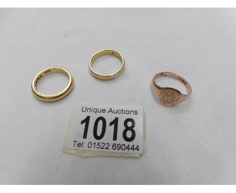 2 22ct gold wedding rings, size U, approximately 19.2 grams and a 9ct gold signet ring, (9ct gold ring 4gms)