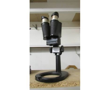 A Russian double lens microscope.