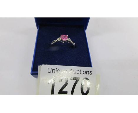 A 9ct white gold ring set with heart shaped pink stone, size N.