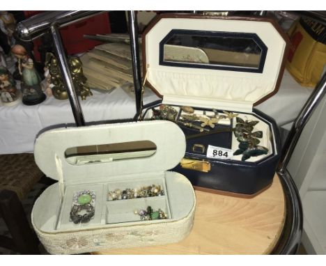 A shelf of cased jewellery