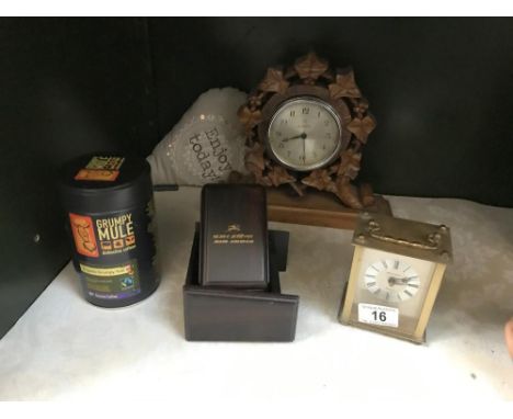 A carved wood mantle clock etc.