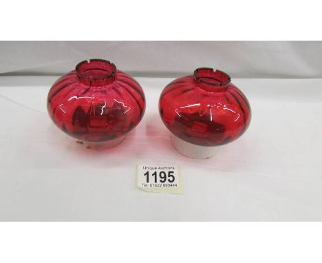 A pair of reproduction oil lamp peg fonts.
