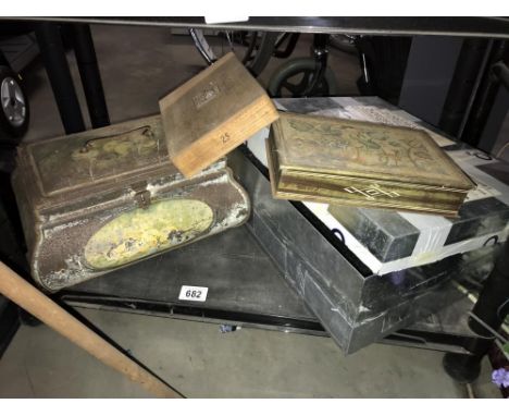 A shelf of tin boxes including collectors tins