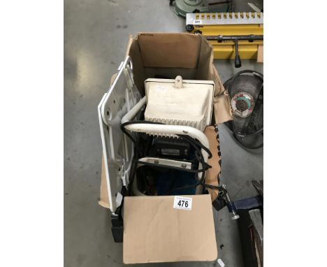 A box of tools including work lamp etc.